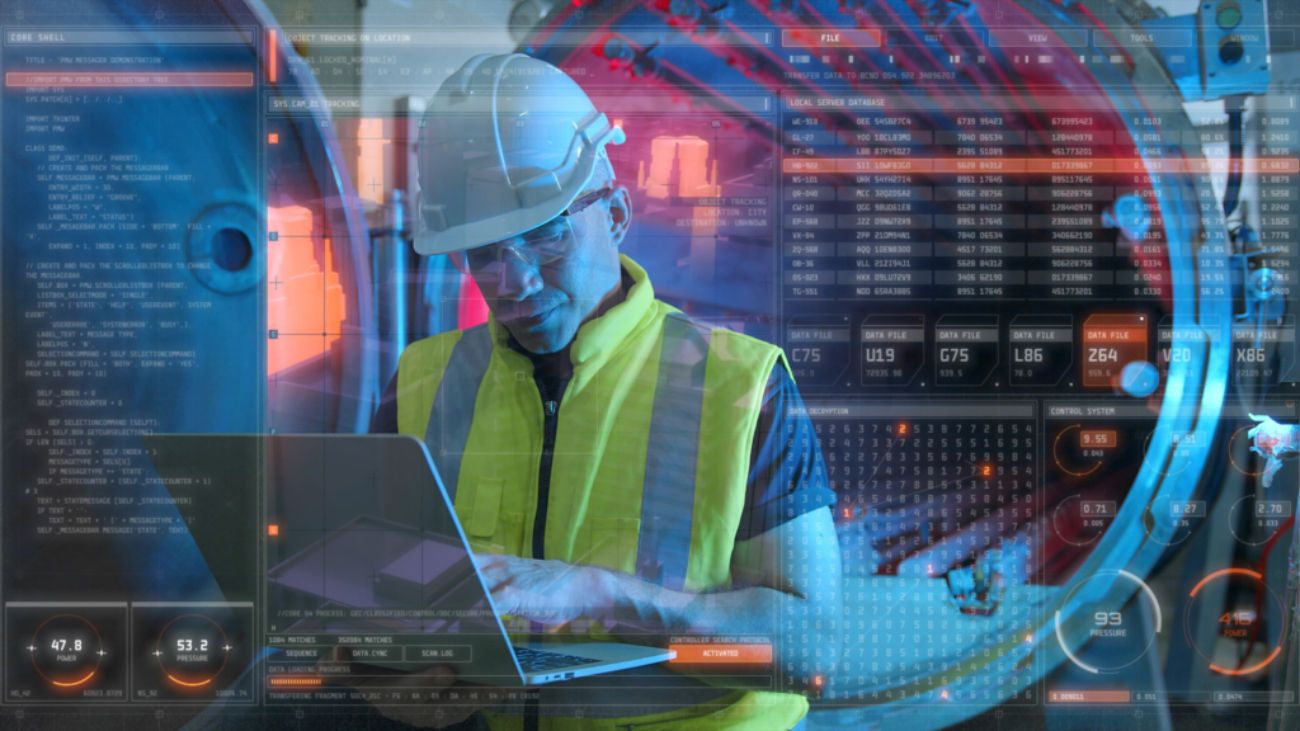 Computer engineer working in factory with laptop computer GUI graphic user interface technology futuristic sci fi HUD background